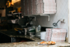 stacked pizza boxes and a Pizza Margherita in Neaples